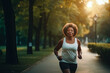 © MVProductions - Middle aged african american woman running at dusk in the park, Generative AI