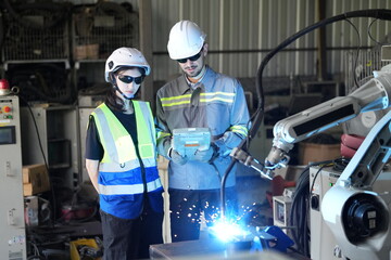 Poster - Robotics engineer working on maintenance of robotic arm in factory warehouse. Business technology.