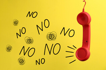 Complaint. Red corded telephone handset, word No and doodles on yellow background