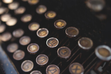 Fototapete - Vintage typewriter with Cyrillic alphabet characters keyboard, writing a text letter on empty page sheet of craft paper, old-fashioned writer machine, view of hands writing book and printing letters