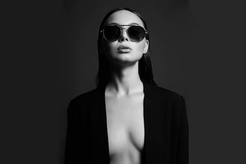 black and white portrait of Beautiful sexy woman in sunglasses