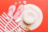 Fototapeta Kawa jest smaczna - beach accessories flat lay top view on colored background Summer travel concept. Bag with starfish and sea shell. Top view