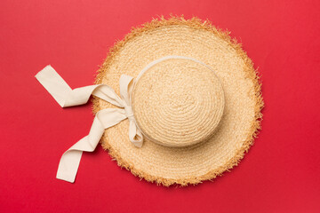 Wall Mural - Straw hat on color background, top view