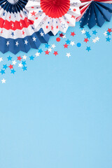 Wall Mural - 4th of July, USA Presidents Day, Independence Day, Memorial day, US election concept. Red white and blue paper fans with stars confetti on blue background. Flat lay, top view, copy space, banner