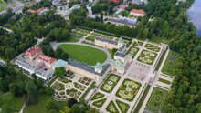 Drone Aerial Top View Of The Ancient Royal Castle Palace With A Park. Wilanów Palace - Warsaw, Poland.