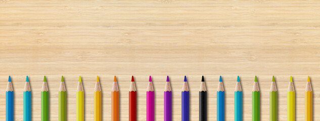 Wall Mural - Colored pencil group isolated on wooden background. Panoramic banner background