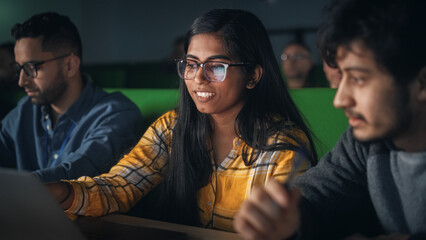 Fototapete - Group of Diverse Happy Students Having a Conversation in University Classroom, Working on a Shared Research Project on a Laptop Computer. Classmates Working Together on College Homework