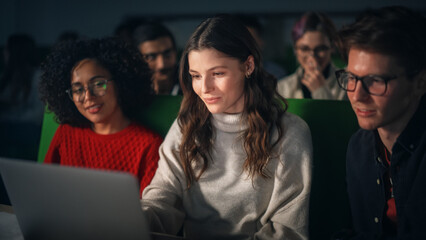 Fototapete - Group of Diverse Happy Students Having a Conversation in University Classroom, Working on a Shared Research Project on a Laptop Computer. Classmates Working Together on College Homework