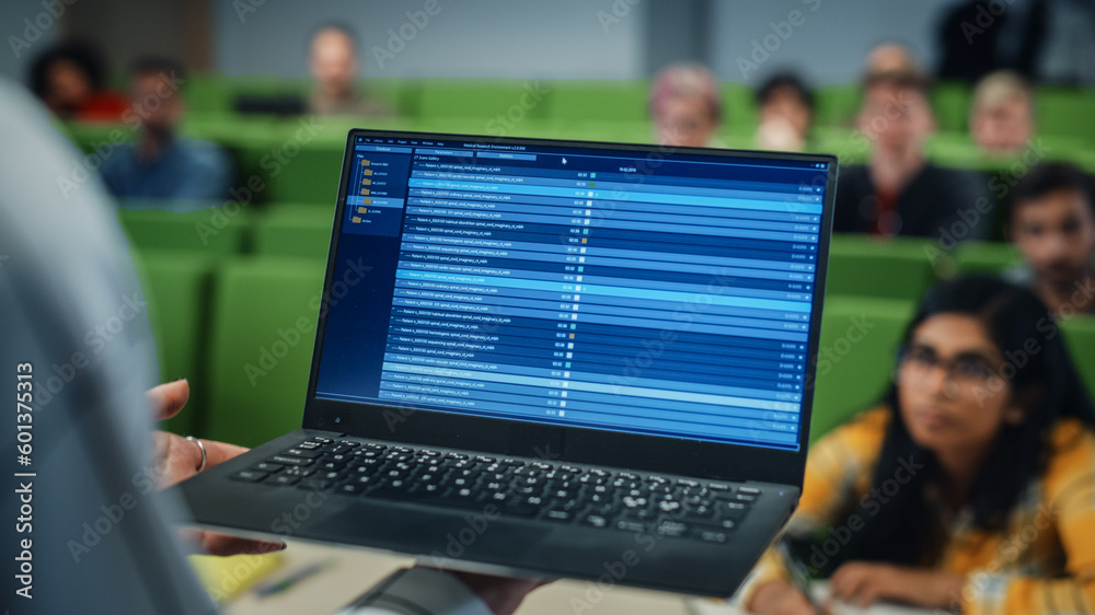 [BAB] å_Close Up of an University Professor Using a Laptop Computer ...