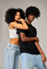 Poster - Portrait of young african american couple wear summer outfit isolated on gray background