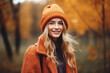 © Jasmina - Portrait of a young beautiful woman with long blonde hair and knitted hat in autumn forest