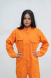 © reewungjunerr - Prisoner in orange robe concept,Portrait of asian woman in Prison uniforms on white background,