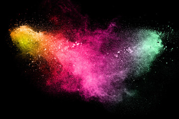 multi color powder explosion on black background.