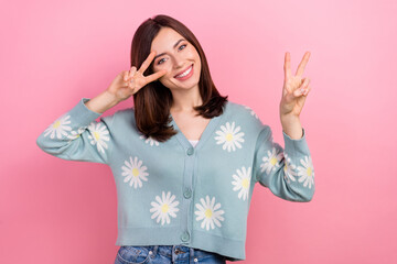 Poster - Portrait of funny youngster girl showing v sign symbol meet friends street say hi make photos isolated pink color background