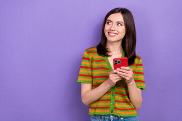 Wall Mural - photo of gorgeous lovely lady stylish striped clothes hold iphone look empty space interesting offer