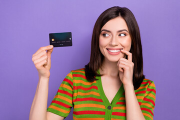 Wall Mural - photo of funky tricky woman dressed striped cardigan finger mouth looking credit card isolated viole