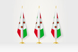 Fototapeta Boho - Three Burundi flags in a row on a golden stand, illustration of press conference and other meetings.