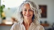 © Adriana - Smiling attractive mature woman looking at the camera. Generative AI
