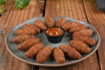 Fried and breaded codfish cake, fish empanadas, codfish cake, Brazilian-style codfish cakes, meat disc