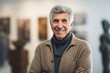 © Leon Waltz - Medium shot portrait photography of a pleased man in his 60s wearing a cozy sweater against an art gallery or museum background. Generative AI