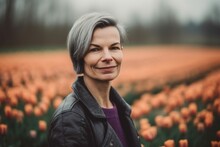Group Portrait Photography Of A Pleased Woman In Her 50s Wearing A Cozy Sweater Against A Flower Field Or Tulip Field Background. Generative AI