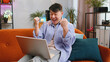 © Andrii Iemelianenko - Oh my God Wow. Surprised asian man using laptop computer, receive good news message, shocked by sudden victory, celebrate lottery jackpot win, purchases online shopping at home. Lifestyle technologies