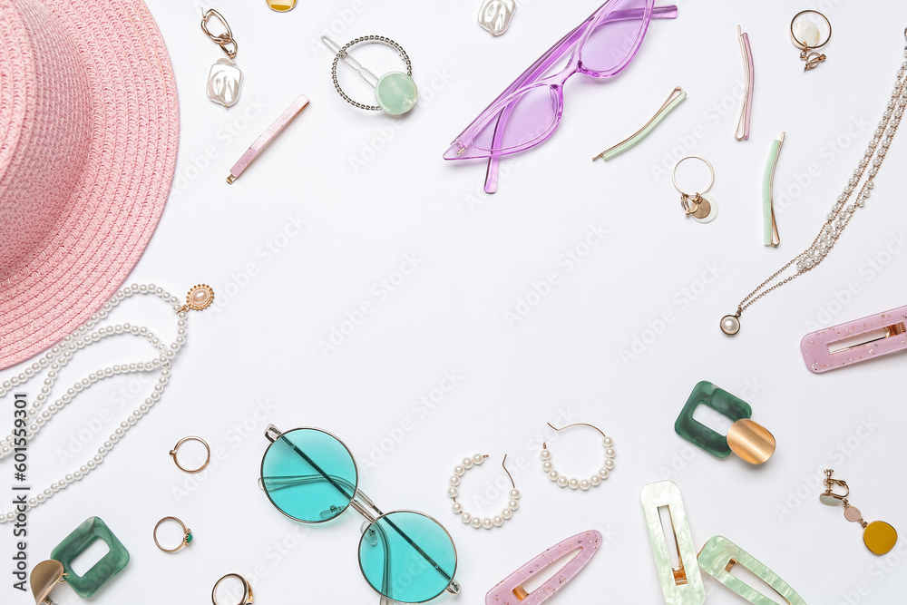 Frame made of accessories with sunglasses on white background