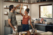 © A. Frank/peopleimages.com - Happy couple, dance and fun bonding in kitchen for romance, love or holiday together at home. Interracial man and woman dancing in happiness for romantic relationship or enjoying weekend in the house
