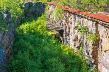 Wall Mural - Old fortress ditch that is blasted into a rock