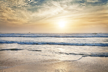 Wall Mural - Beach, water and ocean with sunrise and mockup with blue sky and waves on horizon. Sea landscape, outdoor and nature with sunshine at the coast and seaside with sand and no people with clouds