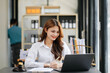 © Nuttapong punna - Beautiful asian woman lawyer working and gavel, tablet, laptop in front, Advice justice and law concept.