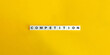 © photoopus - Competition Word on Block Letter Tiles on Yellow Background. Minimal Aesthetics.
