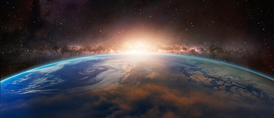 Wall Mural - View of the planet Earth from space during a sunrise against milkyway galaxy 