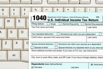 Wall Mural - US federal 1040 tax return form on a keyboard