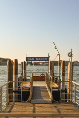 Wall Mural - Pier of St Mark's Square with the islands of San Giorgio Maggiore and Giudecca in the background at sunrise, Venice, Veneto, Italy