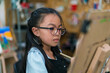© kongga studio - Young girl asian sitting and painting watercolour artwork to develop abilities and improve mental health at home .Female artist drawing with inspiration.