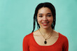 © Carlos David - Young adult woman with braids hair looking at camera, studio shot