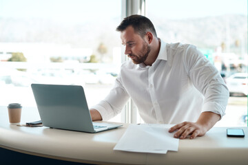Aufkleber - Laptop, documents and car sales man with invoice, quote and financial report for retail or transportation industry. Focus, busy and professional dealership person or boss on computer with paperwork