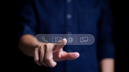 Contact us or Customer support hotline people connect. Man touching on virtual screen contact icons email, telephone, address, live chat, Service concept and customer support Business Contact.