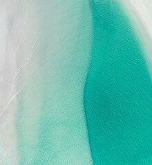 Poster - Aerial view of a beach with nice waves and shades of blues. Beautiful beach and scenes