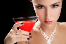 Attractive Cocktail Woman With Jewellery And Martini Red Glass