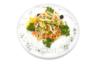 Wall Mural - Salad made with fresh cabbage, cucumber, carrot, parsley. Black olives and slice of lemon added.