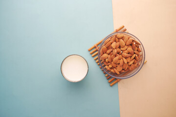 Wall Mural -  almond nut and milk on table 