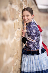 Beautiful woman wearing traditional Eastern Europe folk costumes. Slovak folk costumes.