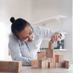 Man, office and building block game, thinking challenge and design innovation for balance and construction. Engineering, architecture and Japanese designer with wood blocks for problem solving games.