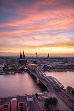 Cologne Skyline At Sunset With View Of Cologne Cathedral And Hohenzollern Bridge, North Rhine-Westphalia, Germany	