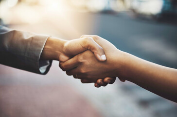 Canvas Print - Business people, handshake and meeting in city for b2b, partnership or introduction and greeting outdoors. Hand of employees shaking hands for team collaboration, agreement or deal for hiring in town