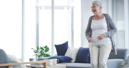 Canvas Print - Dance, freedom and a senior woman have fun alone in the living room of her home during retirement. Party, music or dancing with a happy mature female pensioner laughing while feeling silly or playful