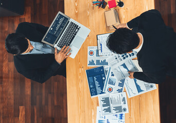 Poster - Top view analyst team discussing financial data on digital dashboard, analyzing chart and graph papers by data science software on wooden table background. Business intelligence and Fintech. Fervent