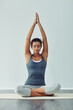 © Viglietti/peopleimages.com - Yoga, meditation and woman stretching for wellness, breathing exercise and healthy body on gym mat. Zen, spiritual and calm female person meditating for balance, mindset and wellbeing for peace